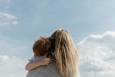 Unidentified woman holding her young child
