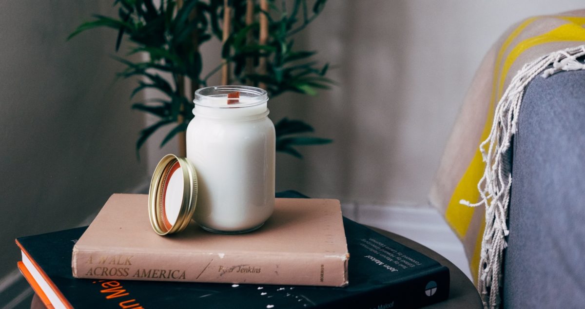 Glass of almond milk sitting on top of a book 