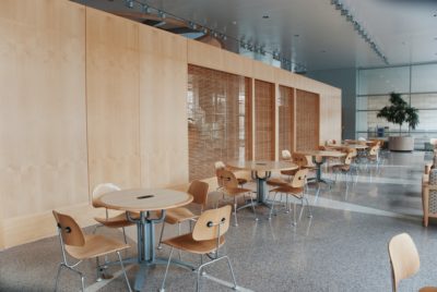 A university canteen full of tables and chairs