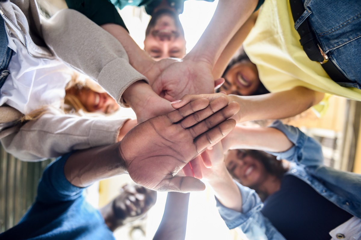 People putting hands together
